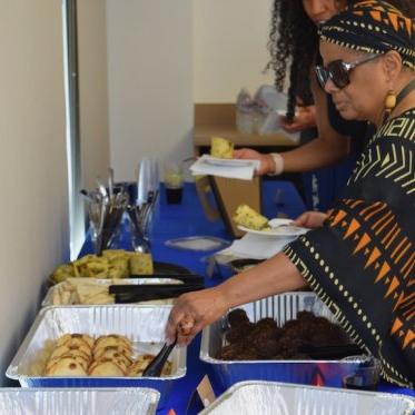 Women taking food onto her plate