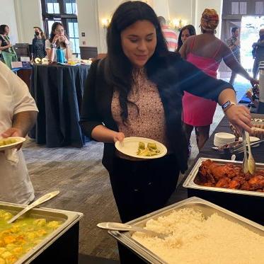 Women taking food onto her plate